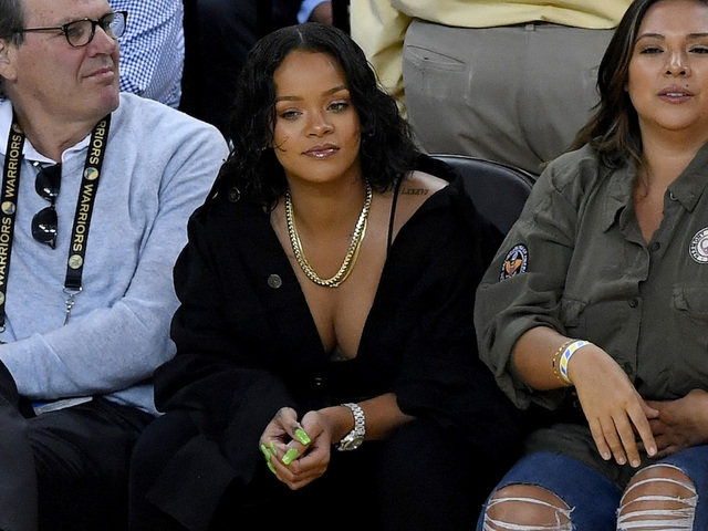 Rihanna, Apple's Eddy Cue Have Opposing Words at NBA Finals Rihanna, Apple's Eddy Cue Have Opposing Words at NBA Finals