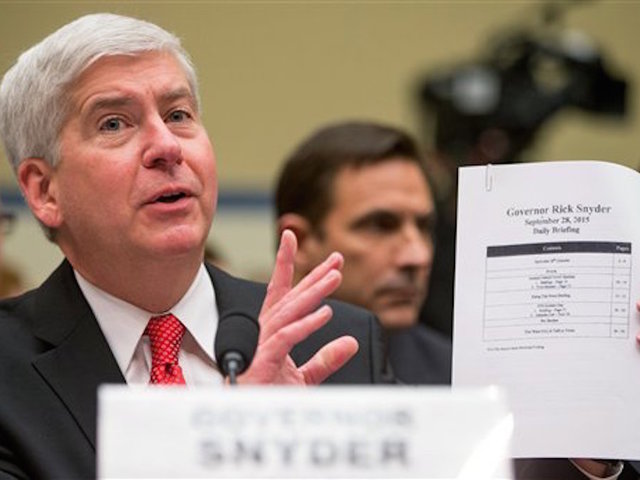 Mich. Gov. faces racketeering suit